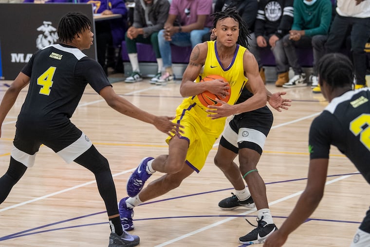 Camden High School, D.J. Wagner, drives to the basket against Roselle Catholic during the first home televised on ESPNU in Camden, N.J. Friday, December 17, 2021.