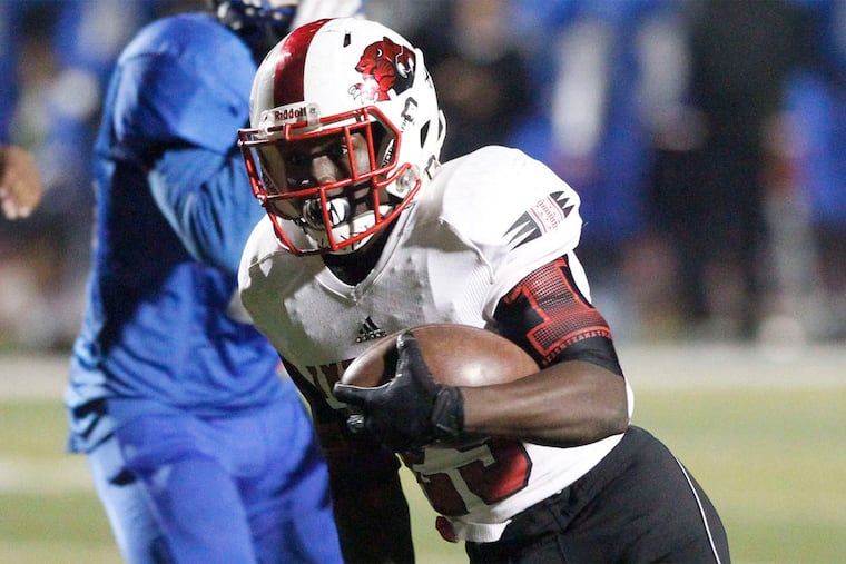 Imhotep's Mike Waters scores a touchdown in the second quarter, his second of three scores, to give the Panthers a 24-8 lead over Academy Park.