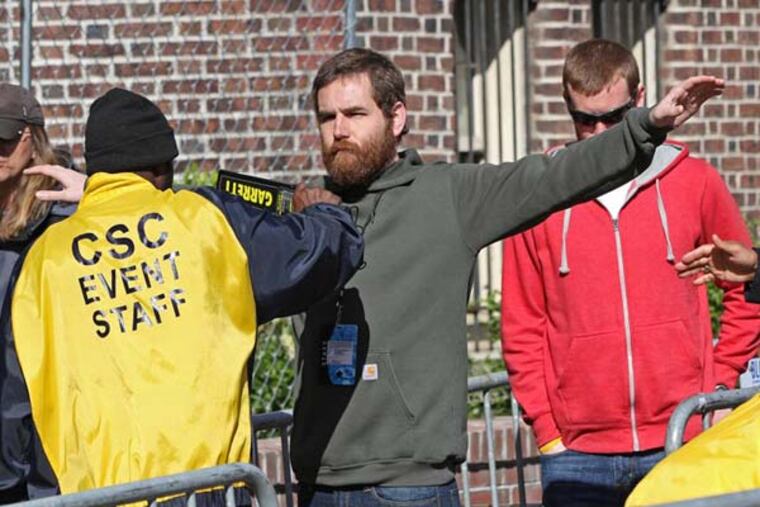 Security was tight at the spectators entrance on the northwest corner of Frankln Field. All ticket holders were wanded and purses were searched. The 119th running of the Penn relays at Franklin Field University of Pennsylvania. Game Action 04/25/2013 ( MICHAEL BRYANT / Staff Photographer )