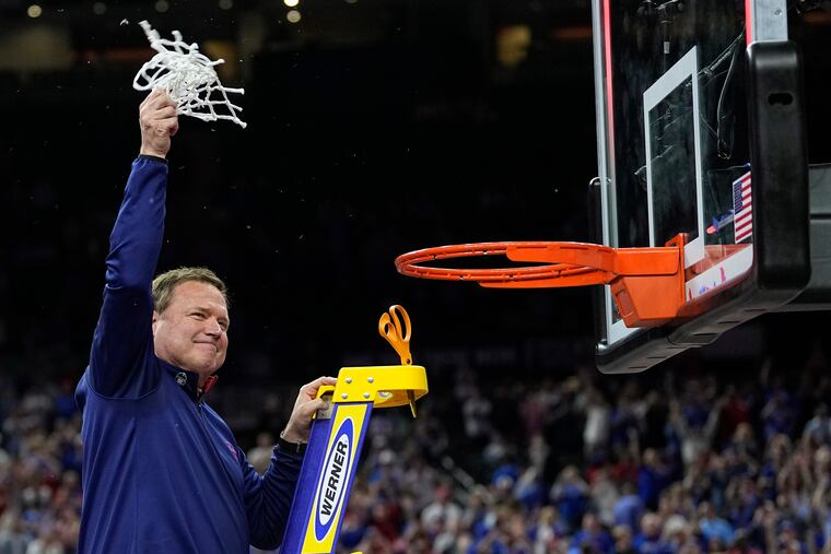 Kansas head coach Bill Self cuts the net after the comeback win against North Carolina for the national championship.