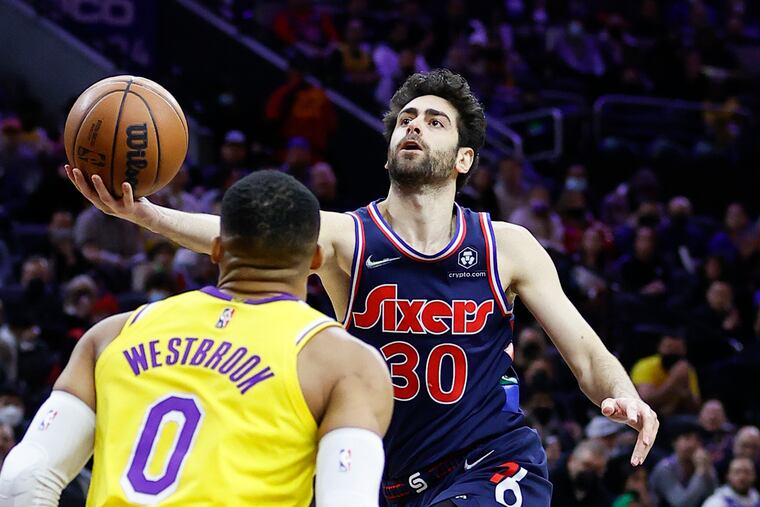 Sixers guard Furkan Korkmaz drives to the basket against Los Angeles Lakers guard Russell Westbrook on Thursday, January 27, 2022 in Philadelphia.