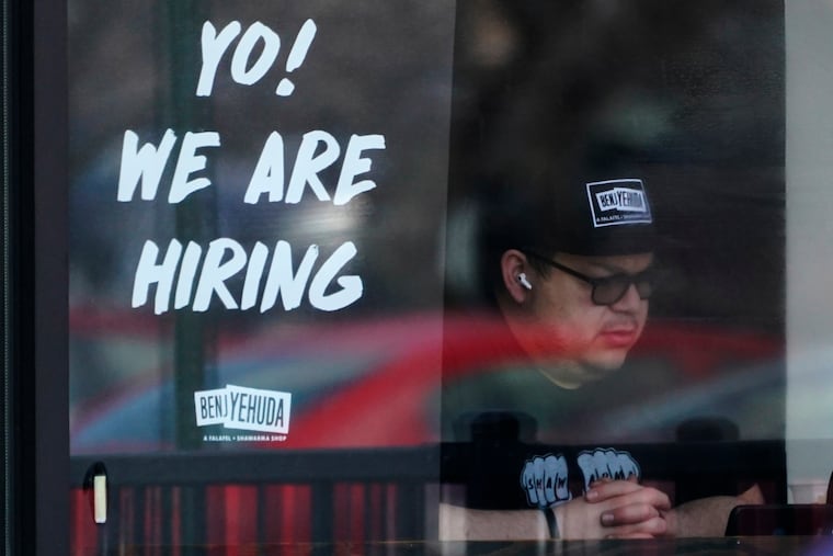 A hiring sign at a restaurant in Schaumburg, Ill., on April 1.