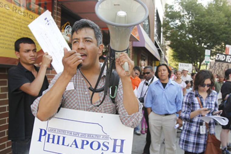 Javier Hernandez leads a march Wednesday in Chinatown sponsored by an interfaith coalition advocating for undocumented immigrants. (Akira Suwa / Staff Photographer)