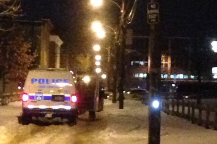 The scene at the Norman Blumberg Apartments in North Philadelphia this morning, Jan. 27, 2014. A law enforcement officer shot a suspect in the area this morning during a chase that began near the housing complex owned by the Philadelphia Housing Authority. (Emily Babay / staff)