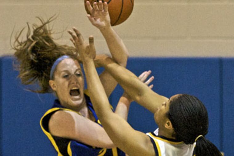 Cheltenham's Dayna McCrewell (right) fouls Downingtown West's Jessica Beswick in the Panthers' District 1 Class AAAA quarterfinal win. McCrewell finished with 12 points. (John Costello / Staff Photographer)