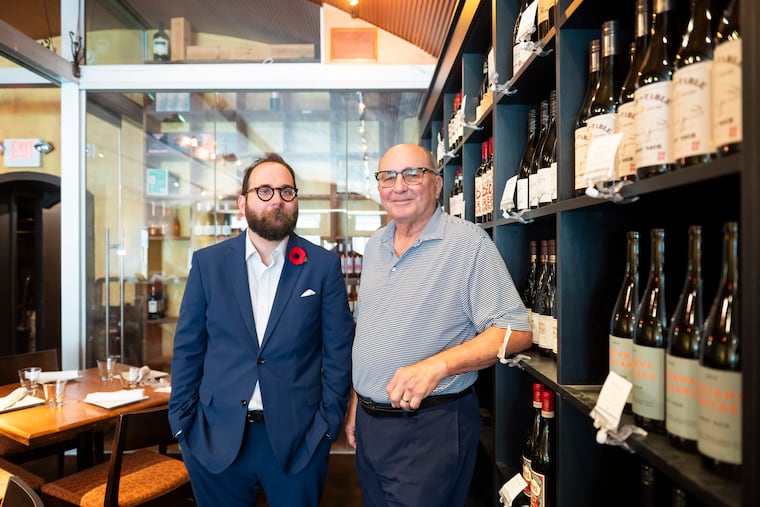 Owner Bruce Cooper (right) at Jake’s & Cooper’s Wine Bar in Manayunk with his son, Bruce Joseph Cooper II, the general manager.