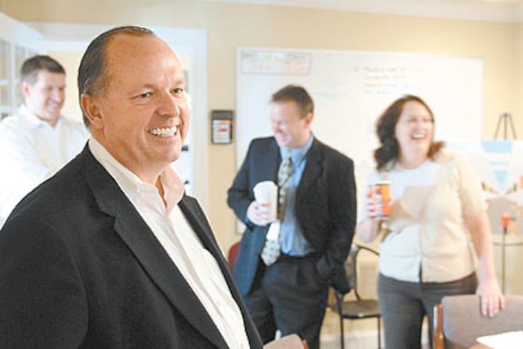 O'Neill Properties chairman Brian O'Neill and his staff share an anecdote as they meet in the construction office at the new Philadelphia Regional Produce Market on Essington Avenue. (Tom Gralish / Staff Photographer)