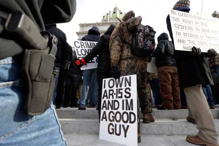 Gun rights advocates demonstrate at the Pennsylvania Capital building Wednesday Jan. 23, 2013, in Harrisburg, Pa. The rally comes amid calls for a boycott of the nine-day Eastern Sports and Outdoor Show in Harrisburg next month, and a growing list of vendors pulling out of the show. (AP Photo/Matt Rourke)