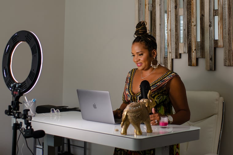 Podcast co-host Sinora Allwood poses in her home studio in Lawrenceville, Georgia on Tuesday, July 13, 2021. Allwood and longtime friend Jillian Baker are co-hosts of A Tribe Called Fertility podcast, which focuses on black maternal health and shared experiences with infertility.