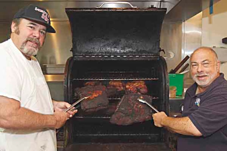Two local guys, Glenn Gross (right) and Ed Willis, owners of Fat Jack's BBQ and Lumpy's BBQ in South Jersey will compete in the TV show BBQ Pitmasters this Sunday. ( AKIRA SUWA / Staff Photographer )