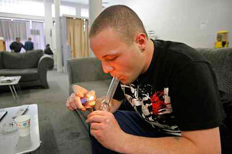 2009 File photo: Samuel Bagdorf of San Francisco lighting a marijuana pipe yesterday at a medical-marijuana clinic in that city.