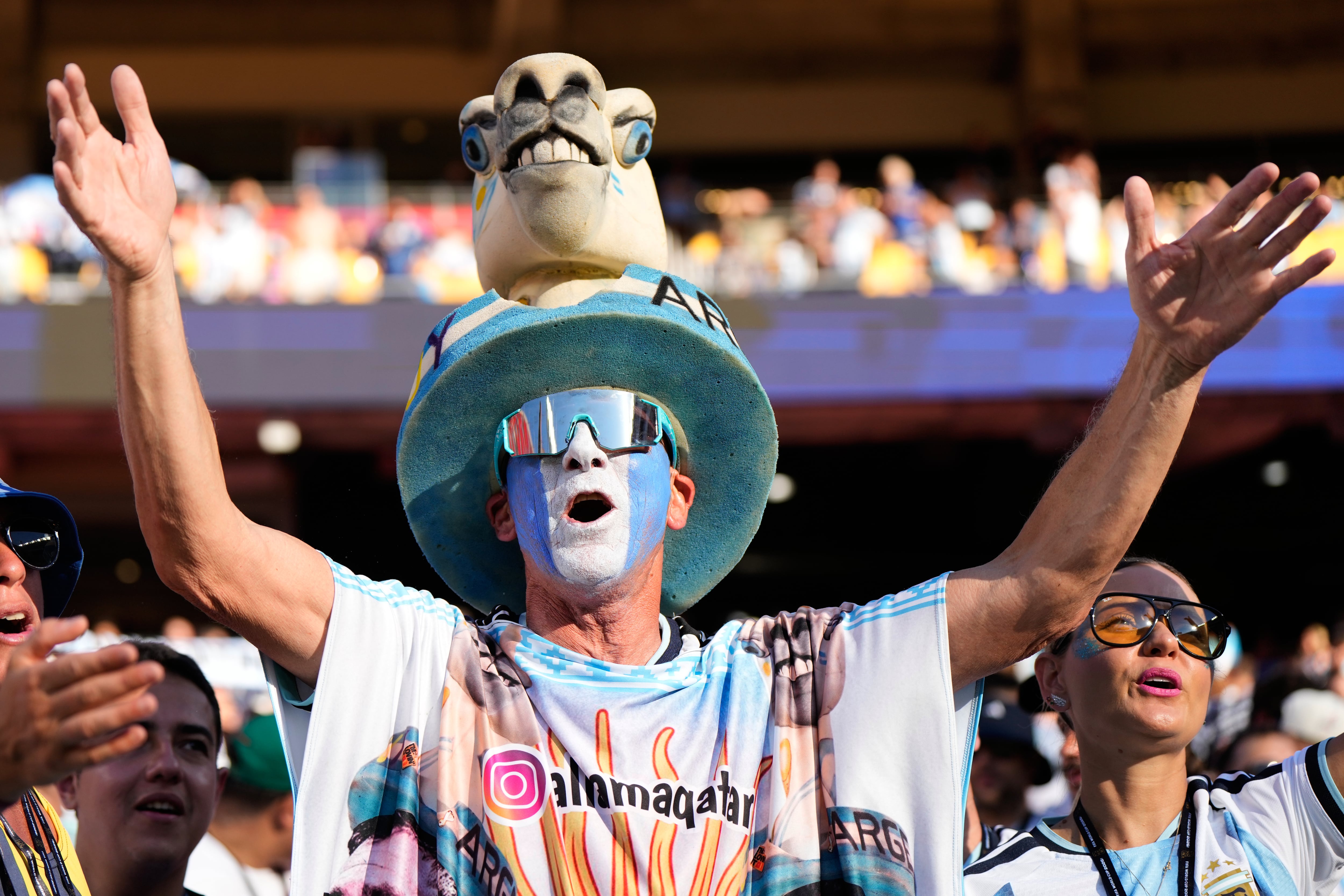 World Cup fans flood stadiums and fan zones with dazzling costumes, facepaint and flags — in photos