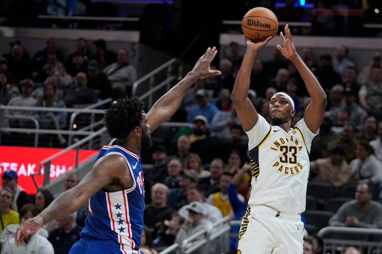Indiana Pacers' Myles Turner (33) shoots over Philadelphia 76ers' Joel Embiid during the second half on Thursday.