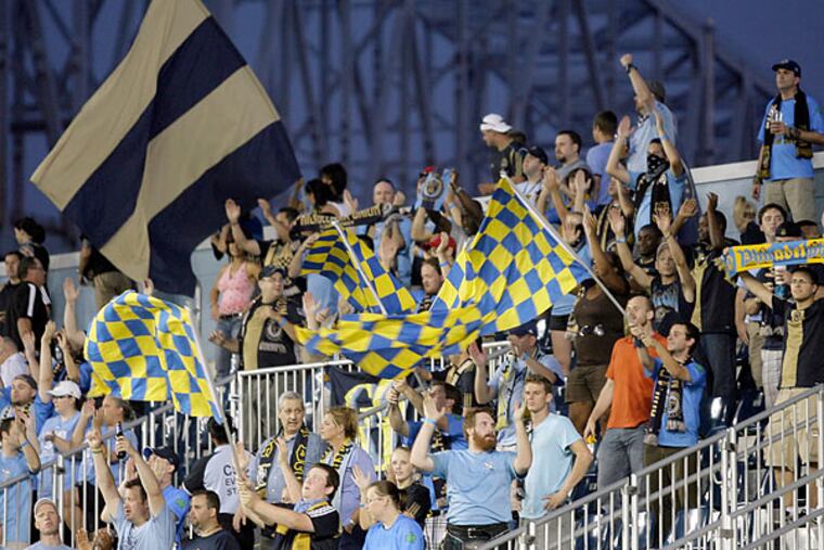 The Sons of Ben pack the 2,000-seat River End at PPL Park, keeping up a drum-banging, flag-waving enthusiasm and leading the crowd in chants and songs. (Yong Kim/Staff Photographer)