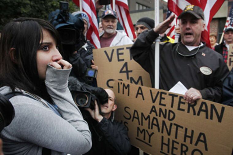 Samantha Pawlucy is overcome as supporters sing "The Star-Spangled Banner" at Carroll High. ALEJANDRO A. ALVAREZ / Staff Photographer
