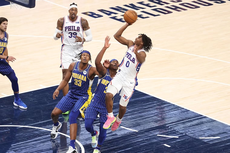 Tyrese Maxey (0) shoots the ball in the game against the Indiana Pacers at Bankers Life Fieldhouse on Sunday.