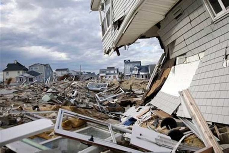 Homes destroyed last October by Superstorm Sandy are seen Thursday, April 25, 2013, at Ortley Beach, in Toms River, N.J. Six months after Sandy devastated the Jersey shore and New York City and pounded coastal areas of New England, the region is dealing with a slow and frustrating, yet often hopeful, recovery. (AP Photo/Mel Evans)