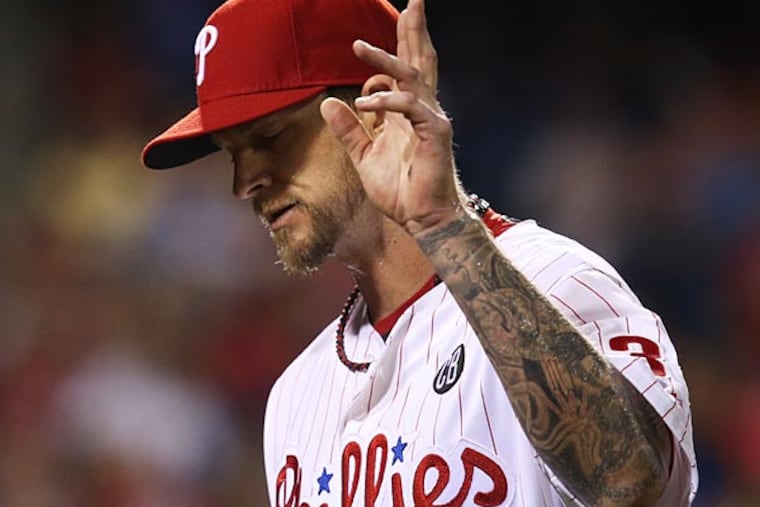 Philadelphia Phillies starting pitcher A.J. Burnett waves to the crowd as he leaves the baseball game in the seventh inning against the Atlanta Braves, Saturday, Sept. 27, 2014, in Philadelphia. The Braves won 4-2. (Laurence Kesterson/AP)