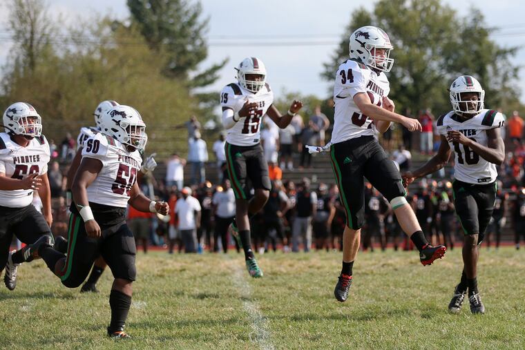Cedar Creek players, shown here celebrating after a win over Woodrow Wilson in September, play in the regional title game next weekend.