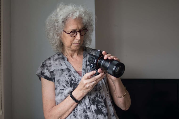 Wednesday, Sept. 27, 2017 Photographer Nancy Hellebrand works with a subject in her apartment in Cherry Hill, N.J For her recent project, Hellebrand is creating nude photos of women's bodies, often focusing just on parts and smaller details.