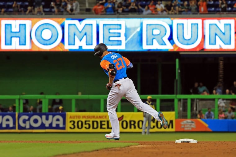 Giancarlo Stanton circles the bases after hitting a home run during a Players Weekend game against the Padres.
