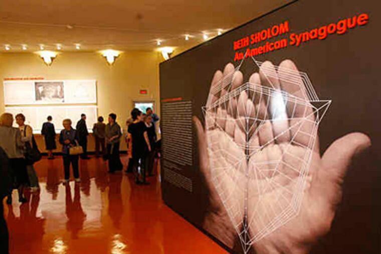 Guests and congregation members touring the visitor center that opened yesterday to mark the 50th anniversary of Elkins Park's modernist Beth Sholom Synagogue, designed by Frank Lloyd Wright. (Charles Fox / Staff)