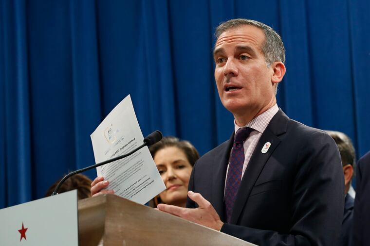 "As long as this disease spreads, we have to continue to scale, and as long as this disease takes lives, we must test," said LA Mayor Eric Garcetti, shown here during a March news conference.