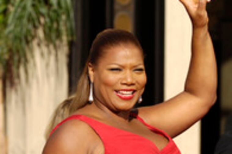 Arriving for the Emmy Awards on Sunday, from left: Queen Latifah, Katherine Heigl and America Ferrera. Read Inquirer fashion writer Elizabeth Wellington's view on what the stars were wearing at http://go.philly.com/mirrorimage.
