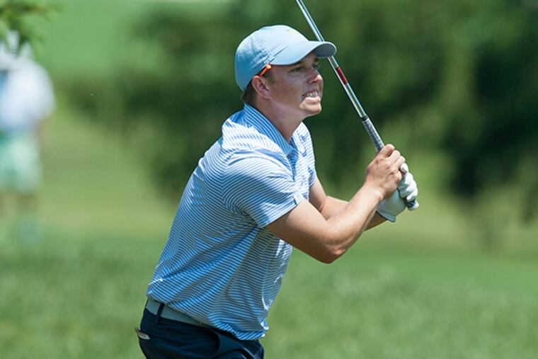 Josh Rackley, assistant pro at Gulph Mills Golf Club, watches approach shot on the 18th hole at Sunnybrook Golf Club in Plymouth Meeting fly into a sandtrap during the 2015 Haverford Trust Philadelphia PGA Classic. Rackley bogeyed the 18th but finished at minus-2 for the tournament. ( CLEM MURRAY / Staff Photographer )