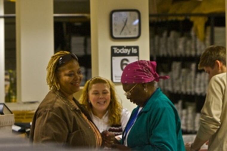 Voters register at the Philadelphia County voter registration office at the corner of Spring Garden and Delaware Avenue.