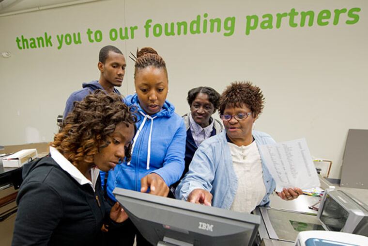 Cashiers and customer service associates at the new Fare & Square supermarket in Chester try out the new cash registers at the store Sept. 24, 2013. The grand opening for the non-profit supermarket will be Sept. 28, 2013. The cashiers, all from Chester, are (from left): Kiyana Mills, Brandon Freeman, Karen Kelly, Tammy Jones and Ruth Richardson. ( CLEM MURRAY / Staff Photographer )