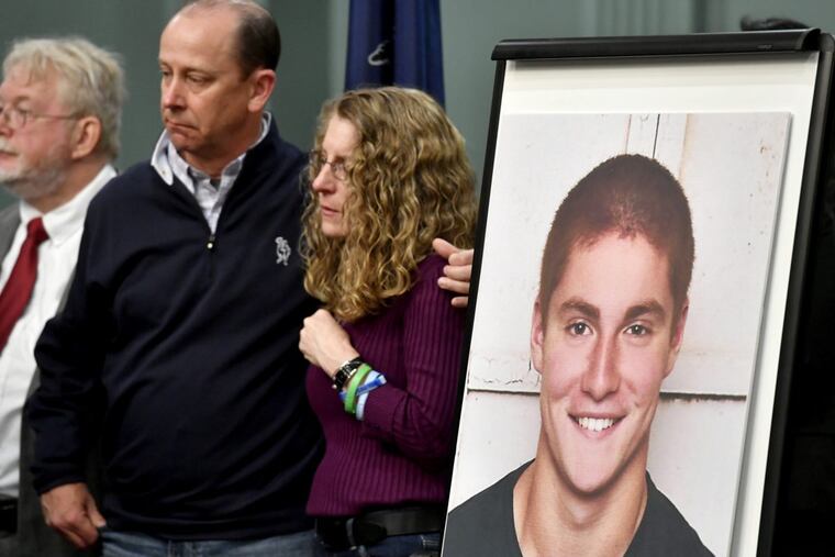Jim and Evelyn Piazza with a photo of their son, who died after hazing at Penn State. (ABBY DREY / Centre Daily Times, File)