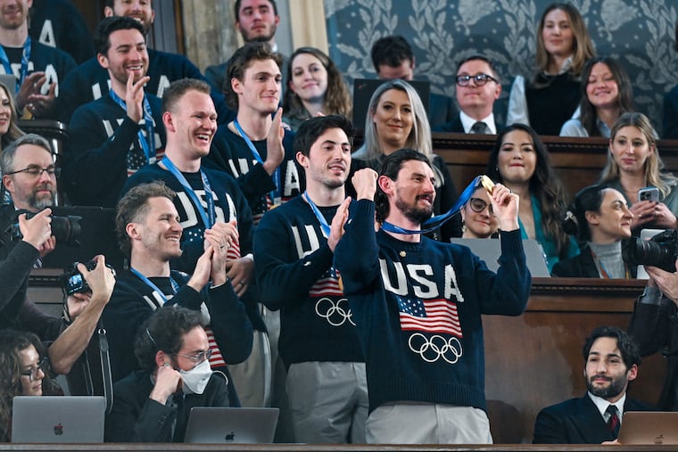 Members of the United States' Olympic hockey team, goalie Connor Hellebuyck in front, attend President Donald Trump's State of the Union address on Tuesday.