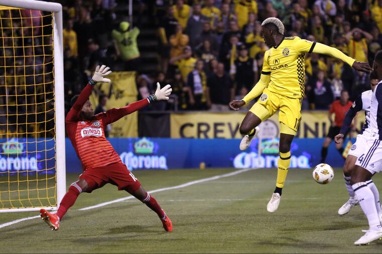 Union goalkeeper Andre Blake (left) blocks the shot of Columbus Crew forward Gyasi Zerdes during the first half of the Union's tie on Saturday.