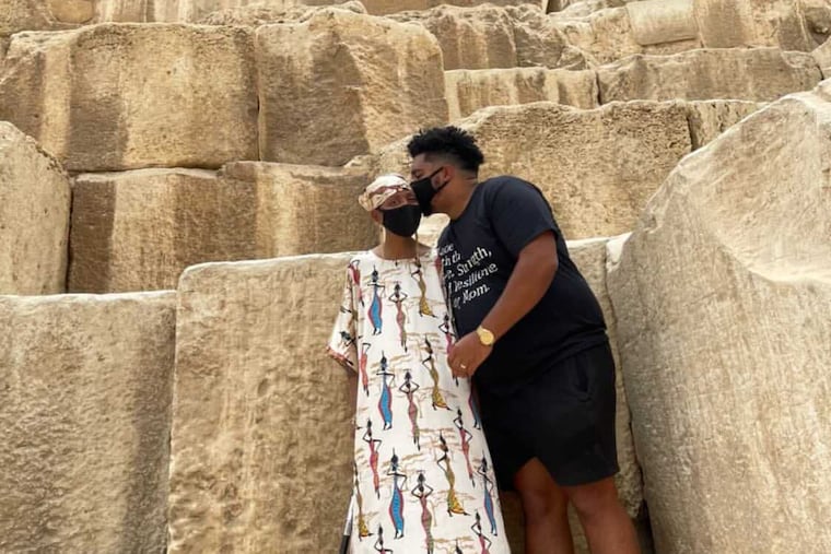 Dustin Vitale kisses the forehead of his mother, Gloria Walker, in Giza, Egypt, in May.