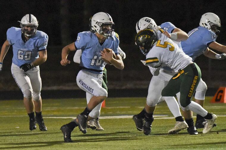 Shawnee’s Colin Wetterau runs the ball during the first half of Friday night’s Group 4 playoff game at Shawnee High School in Medford, NJ.