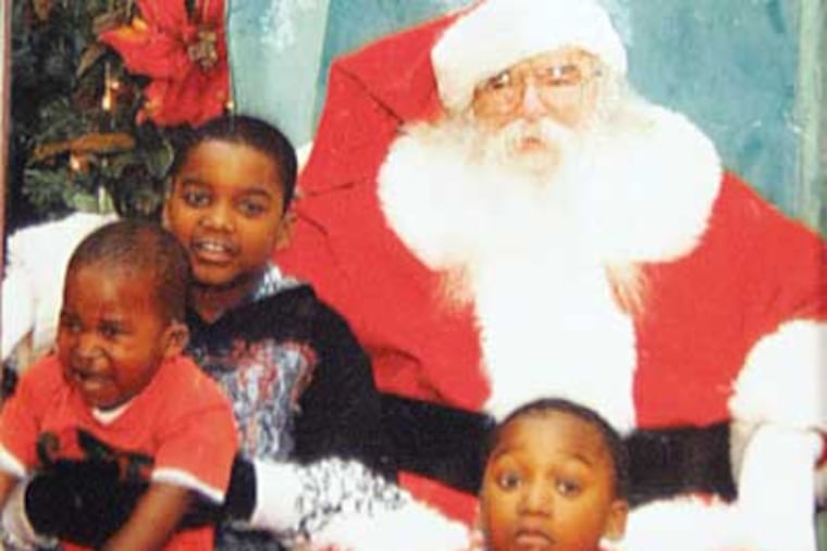 Michelle Dosso's family photographs of three of her children that
died in the fire. From left, Zyhire Wright-Teah, 1, Mariam Dosso, 6,
Ramere Dosso, 8. ( David Swanson / Staff Photographer )