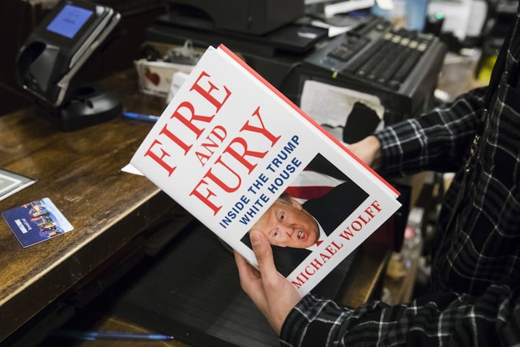 A salesperson rings up a copy of the book "Fire and Fury: Inside the Trump White House" by Michael Wolff at a Barnes & Noble store in Philadelphia, Friday, Jan. 5, 2018.