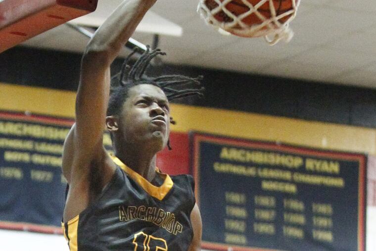 Seth Pinkney of Archbishop Wood dunks in a game in January 2017.