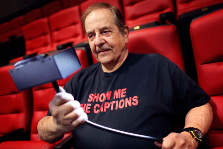 Alan Kutner sets up a captioning receiver at the Bryn Mawr Film Institute. Narration headsets are available for the visually impaired. (Michael S. Wirtz/Staff)