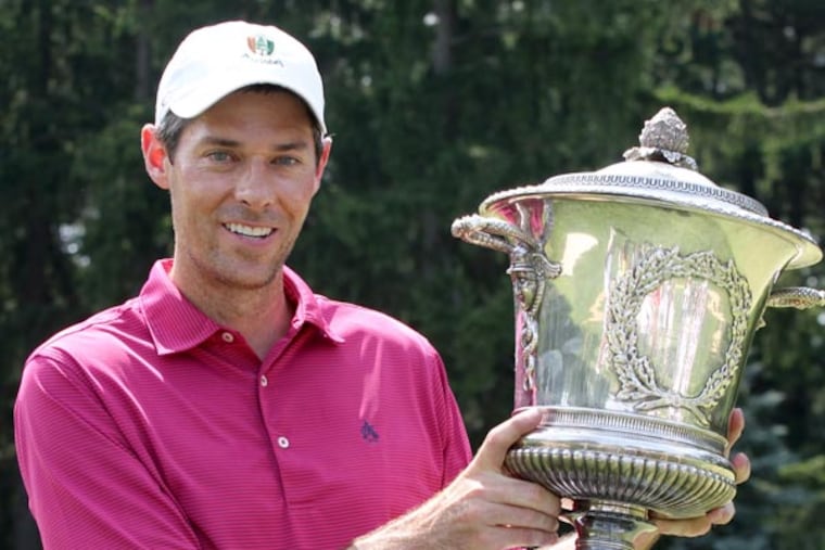 Michael McDermott holds the trophy after winning the Golf Association
of Philadelphia's 113th Amateur Championship at Aronimink Golf Club on
June 22, 2013. (Charles Fox/Staff Photographer)