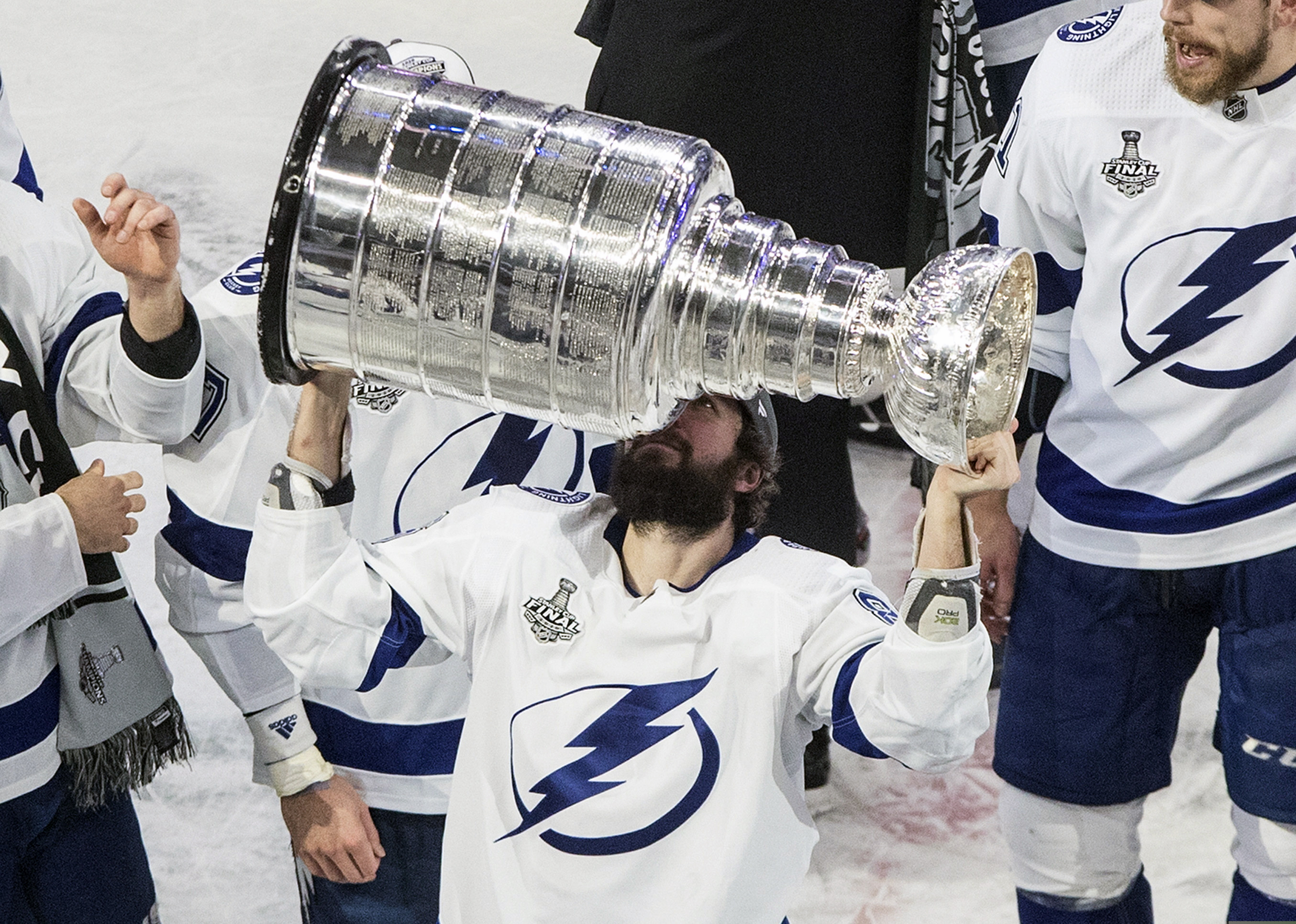 The Tampa Bay Lightning's Nikita Kucherov hoists the Stanley Cup after defeating the Dallas Stars in Game 6 Monday in Edmonton, Alberta.