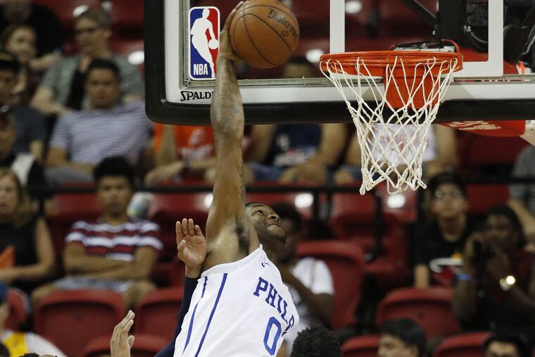 Cam Oliver dunks throws down a dunk on Monday against the Wizards.