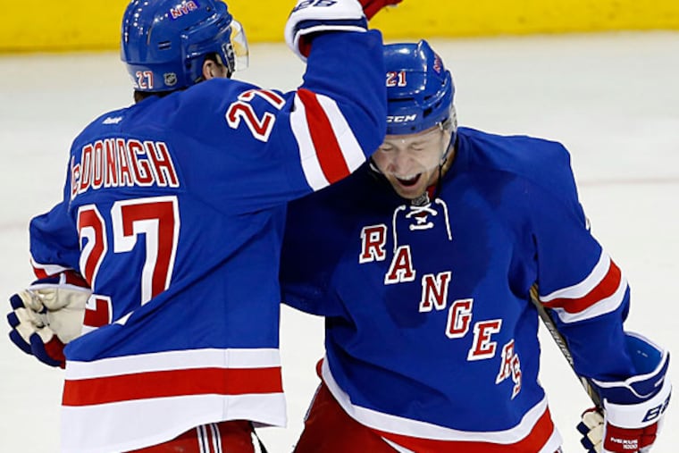 The Rangers' Derek Stepan (right) celebrates his goal with teammate Ryan McDonagh against the Flyers. (Yong Kim/Staff Photographer)