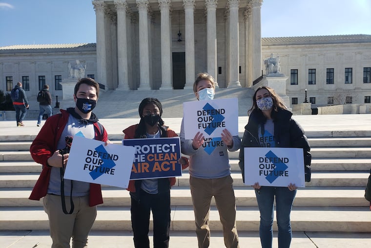 Conor Williams (left) joined ambassadors from the climate group Defend Our Future on the steps of the U.S. Supreme Court on Monday, Feb. 28, 2022.