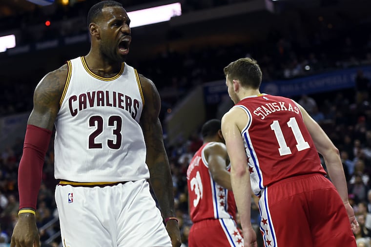 LeBron James (23) reacts after a dunk during the second half.