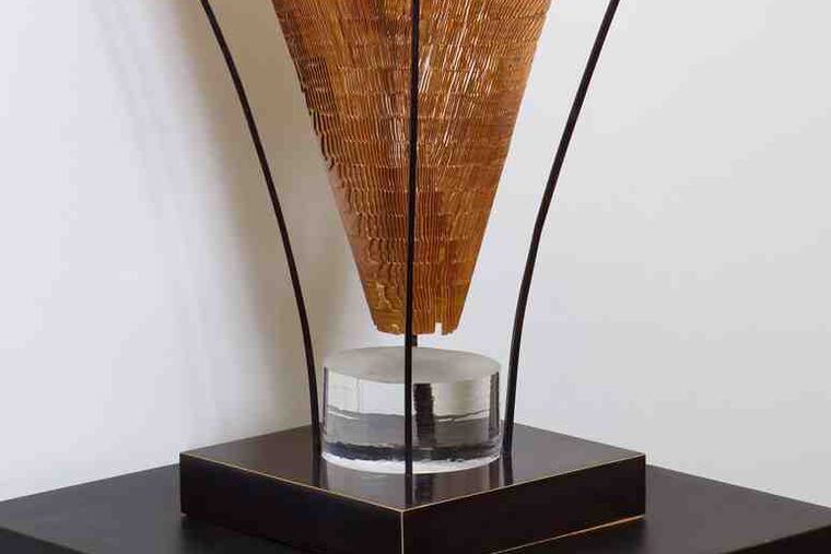 "Sandblasted Artifact," by Michael Brolly, refines and combines bronze, glass, and wood. It is among prizewinners in "Craft Forms 2010."