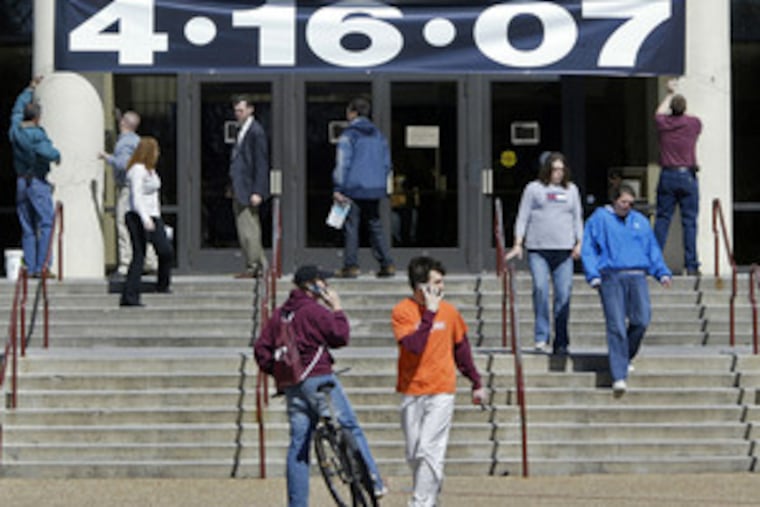 A memorial banner marking the date of the tragedy hangs over doorways to student center.