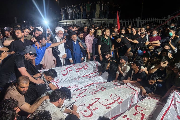 Shiite Muslims attend funeral prayer of protesters, who were killed in the violent clashes with security forces during a rally to condemn the killing of Iranian Supreme Leader Ayatollah Ali Khamenei, in Karachi, Pakistan, Sunday, March 1, 2026.