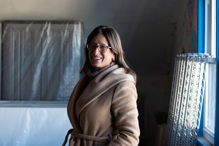 Former Villanova professor Stephanie Sena stands on the third floor of the homeless shelter she opened in Upper Darby. This picture was taken in December 2022 before the shelter opened.